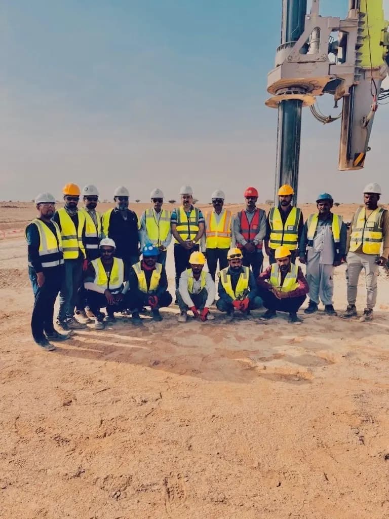 TIMC site crew in safety gear with drilling equipment on a project site in Saudi Arabia